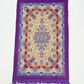 Classic travel prayer mat featuring an elegant Islamic archway design with floral patterns, decorative fringe, and a matching zippered carry pouch with shoulder strap for portable daily prayer.