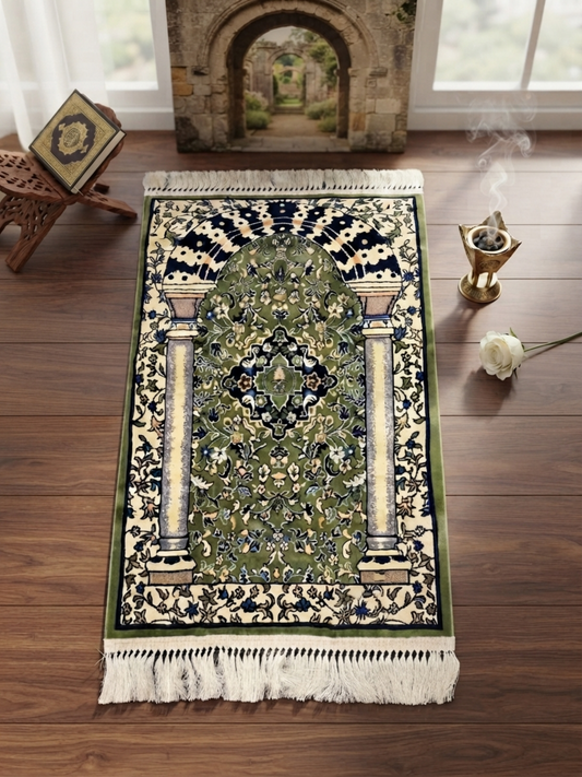 Mihrab Nusuki Premium Islamic Prayer Mat featuring an elegant green and ivory mihrab arch design with floral patterns, decorative tassels, and a portable fabric carrying bag.