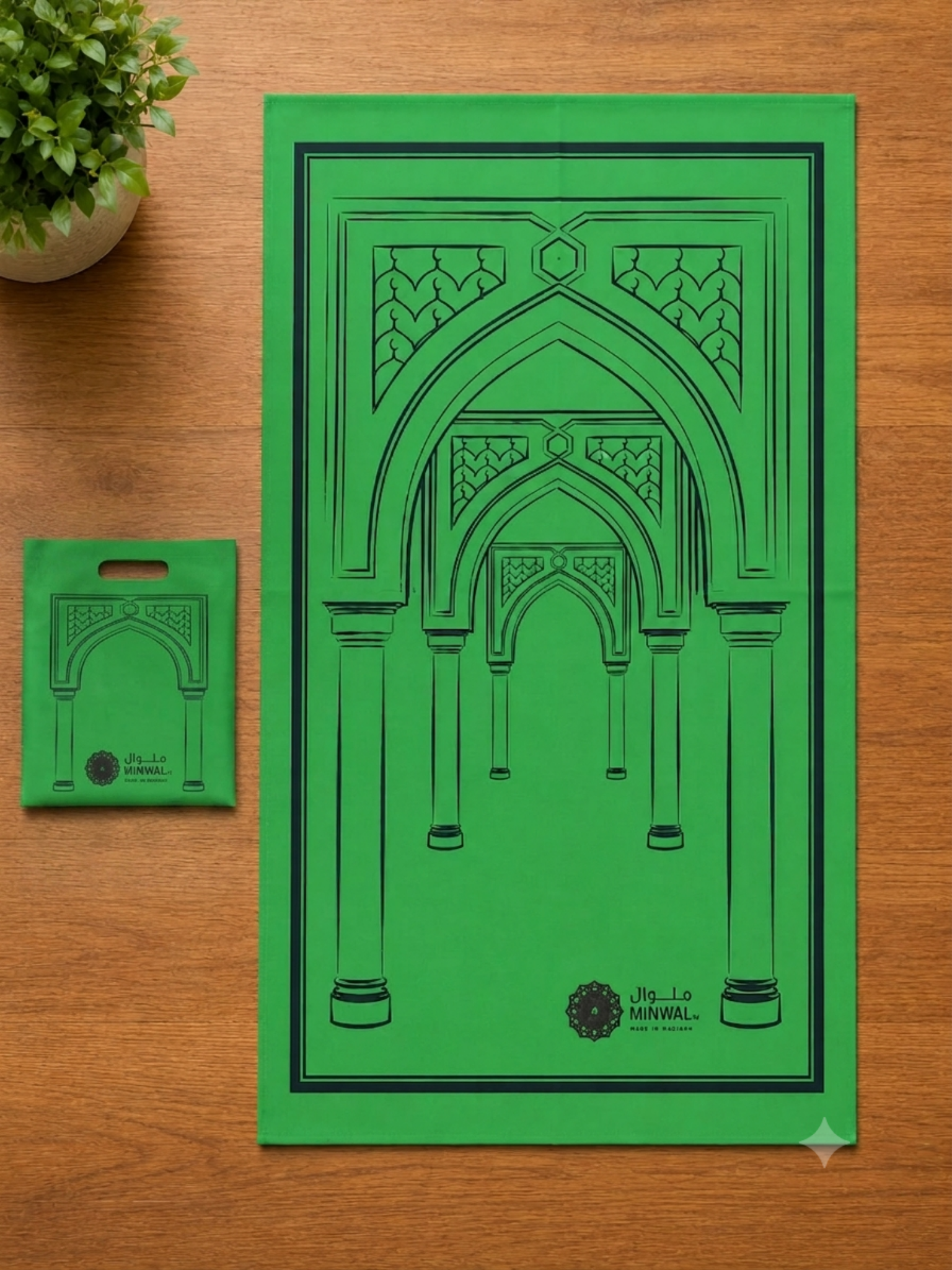 Minwal non-woven travel prayer mat featuring a minimalist mosque arch design in black and white with a matching foldable carry pouch for convenient daily use and travel.