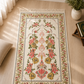NUSUKI Turkish embroidered floral prayer mat featuring a cream background with colorful floral embroidery, decorative tassels, and premium durable fabric for daily Islamic prayer.